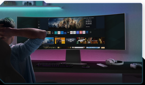 Person sitting in front of Samsung Odyssey G9 49-inch OLED monitor