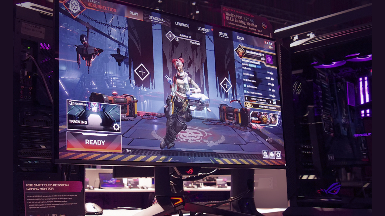 Asus ROG Swift OLED PG32UCDM next to computer 