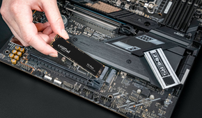 Crucial P3 Plus PCIe M.2 2280 SSD being installed into a motherboard.