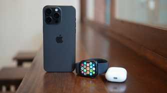 Apple Watch Series 9 next to an iPhone and AirPods Pro 2 case