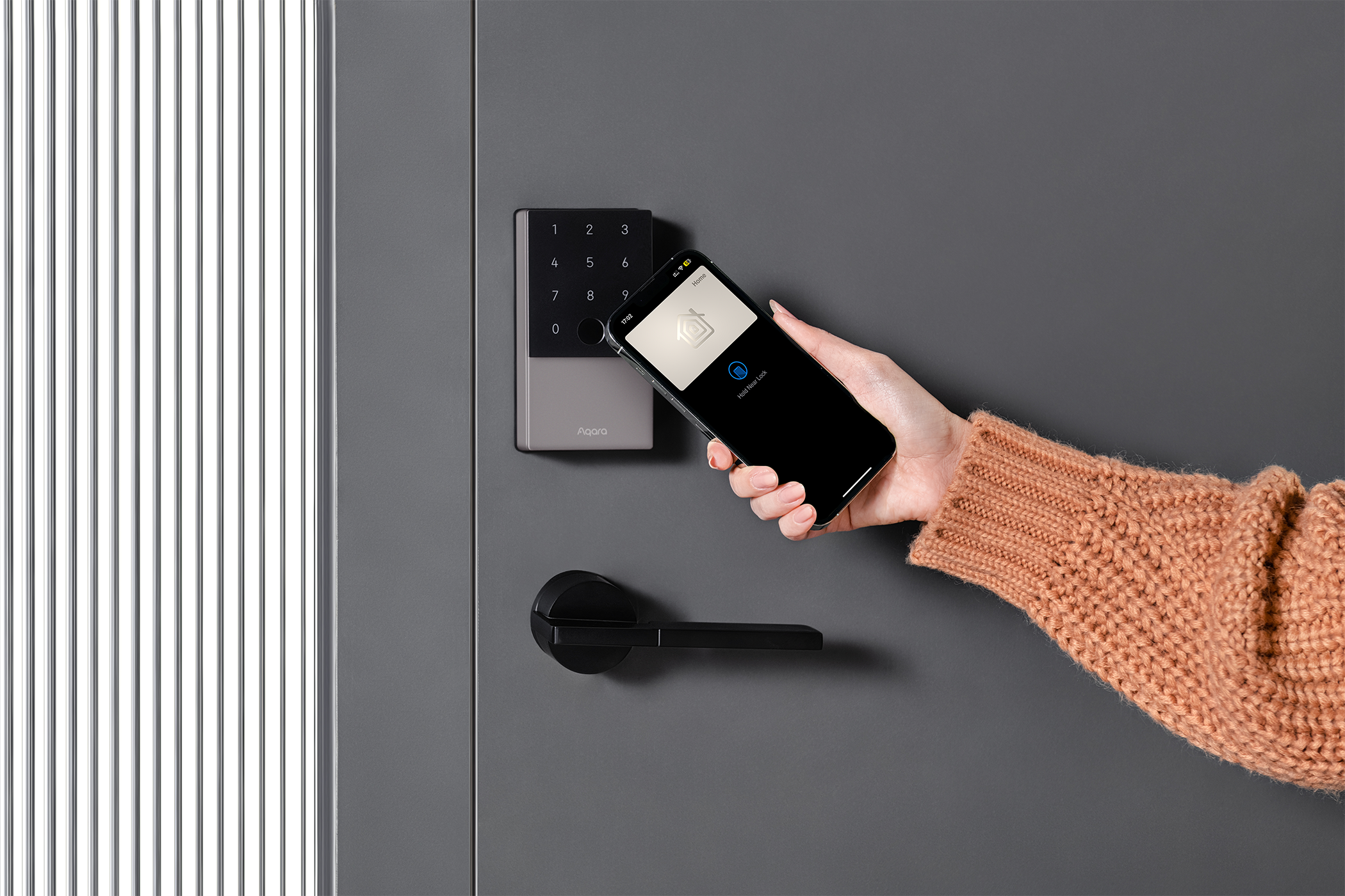 A woman opens her smart lock using her smartphone