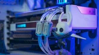 Cloe up of a figurine inside a PC case next to the GPU