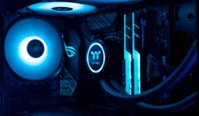 Close up of gaming PC showing fan, RAM, and CPU cooler in blue lighting