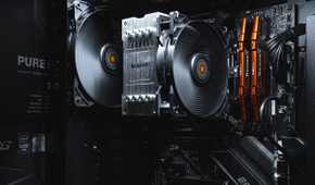 Gaming PC internals showing motherboard, CPU cooler, and RAM