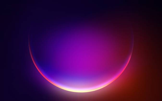 A colorful bubble glowing in a gradient from purple to red over a dark background