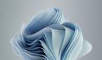 A variant of the Windows 11 Bloom wallpaper with a nearly-white blue color