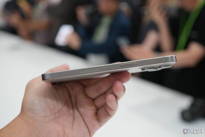 A person holding an iPhone 15 Pro Max.