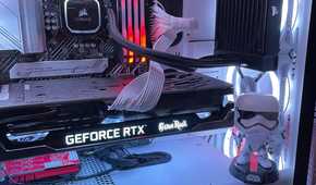 Stormtrooper action figure inside gaming PC with lights.