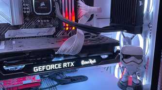 Stormtrooper action figure inside gaming PC with lights.