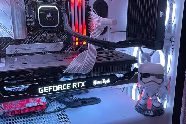 Stormtrooper action figure inside gaming PC with lights.
