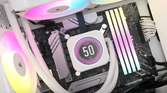 Corsair iCUE H150i Elite LCD XT Liquid CPU Cooler in a PC glowing with RGB lighting