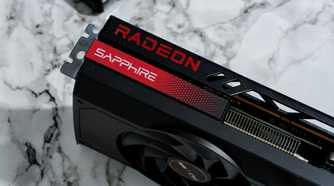 An image showing an AMD Radeon RX 7700 XT GPU kept on a desk with a marble finish.