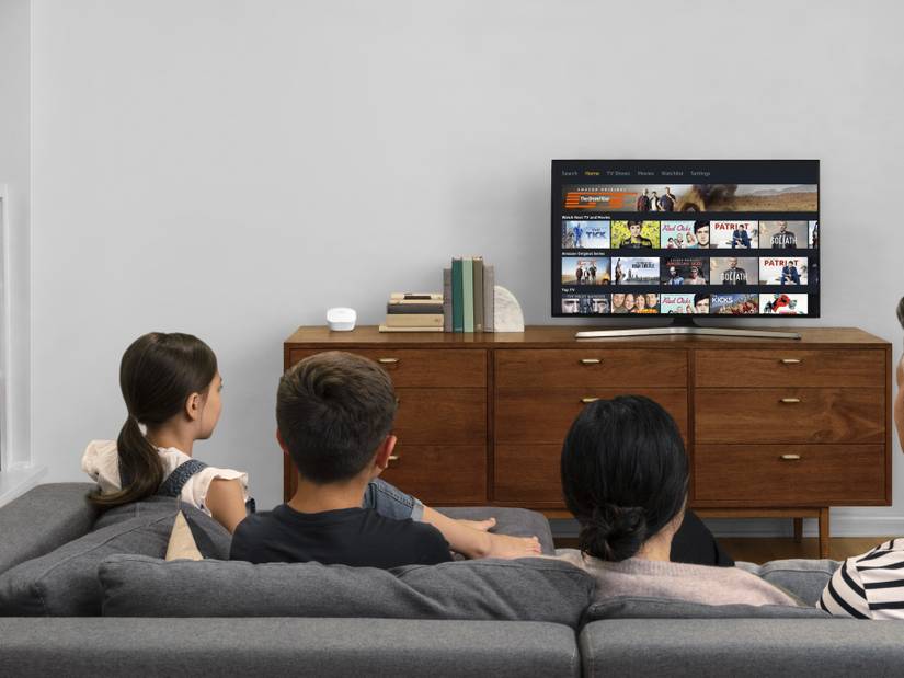Eero mesh router next to a TV
