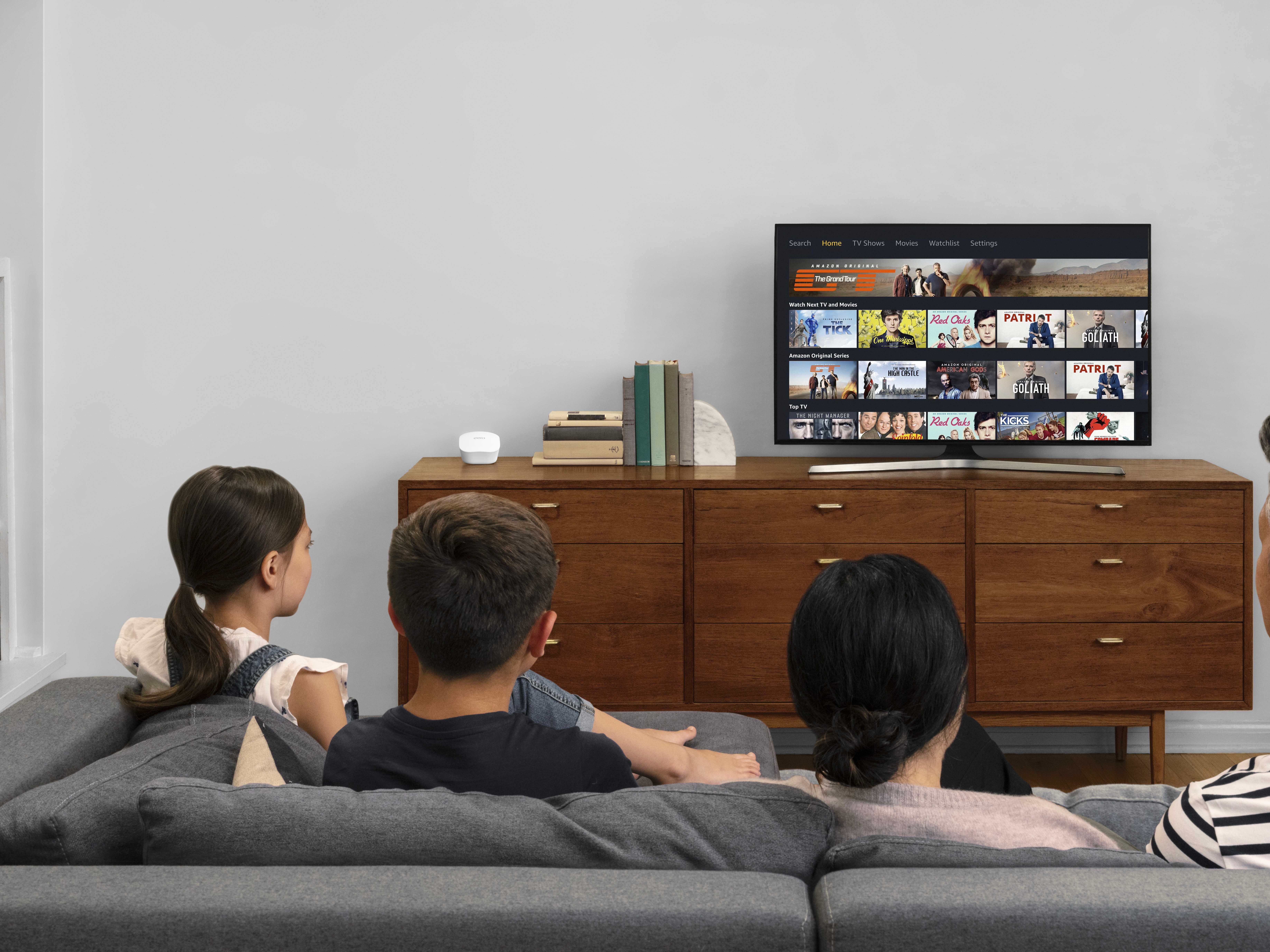 Eero mesh router next to a TV