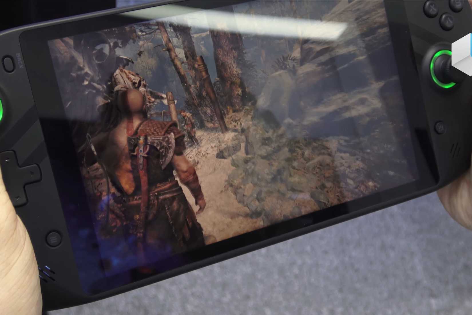 A handheld gaming PC running God of War