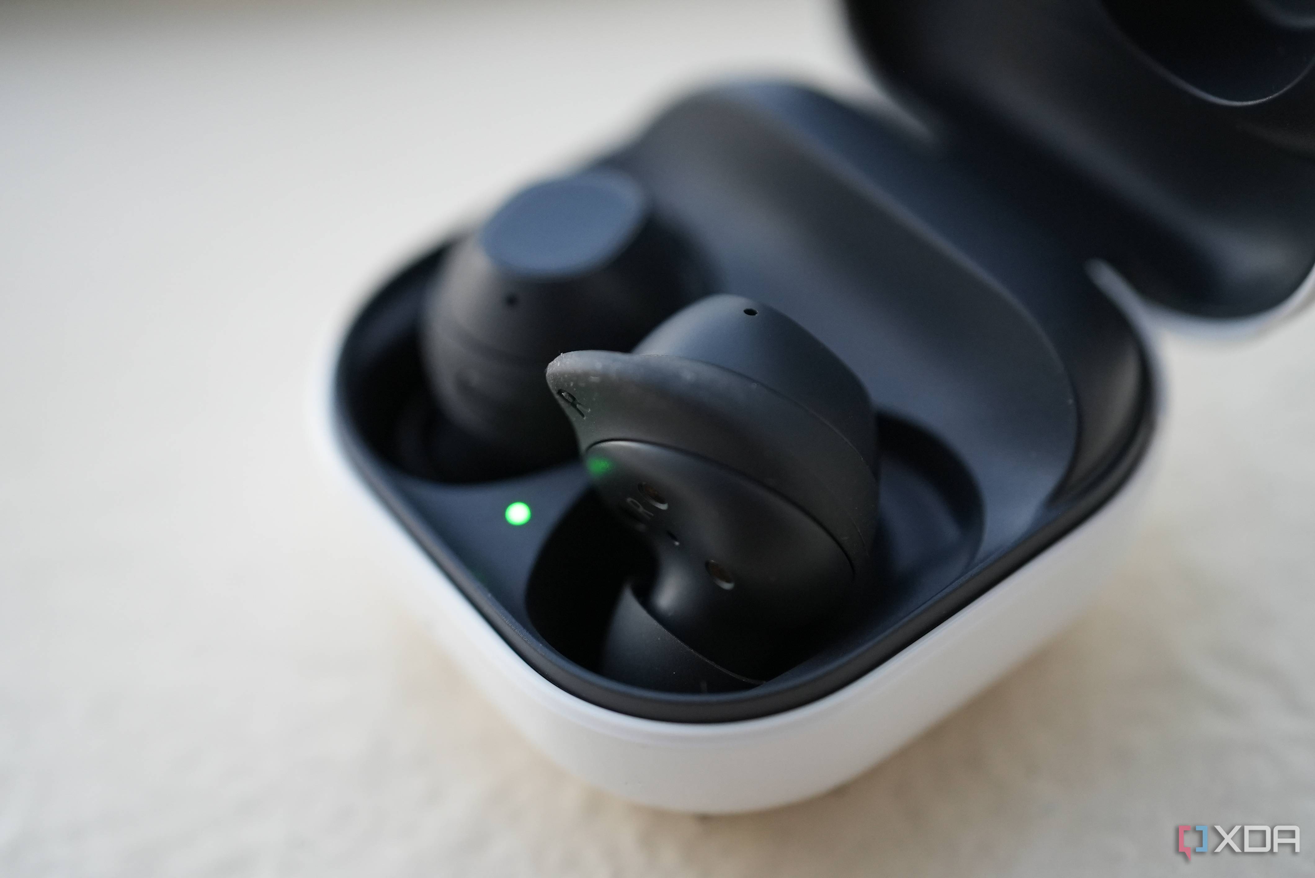 Galaxy Buds FE with one bud sticking out of the case