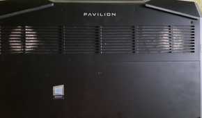 An image showing a laptop with dust buildup on the vents on its back