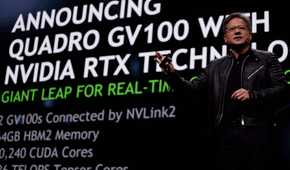Nvidia CEO Jensen Huang on stage with Quadro GV100 details behind him