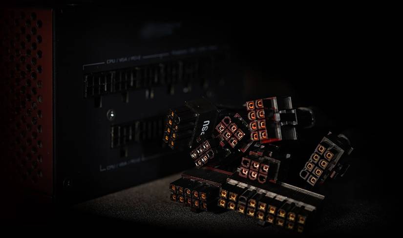A black modular power supply with its cable connectors