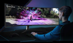 Person sitting in front of Samsung 57-inch Odyssey Neo G9 monitor
