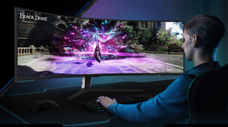 Person sitting in front of Samsung 57-inch Odyssey Neo G9 monitor