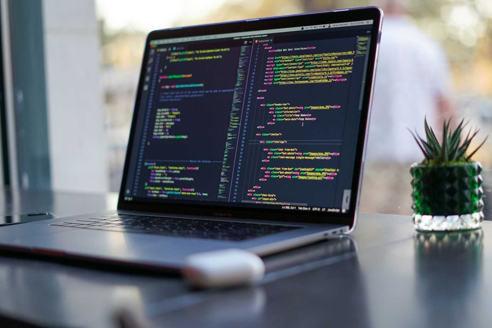 A laptop showing code.