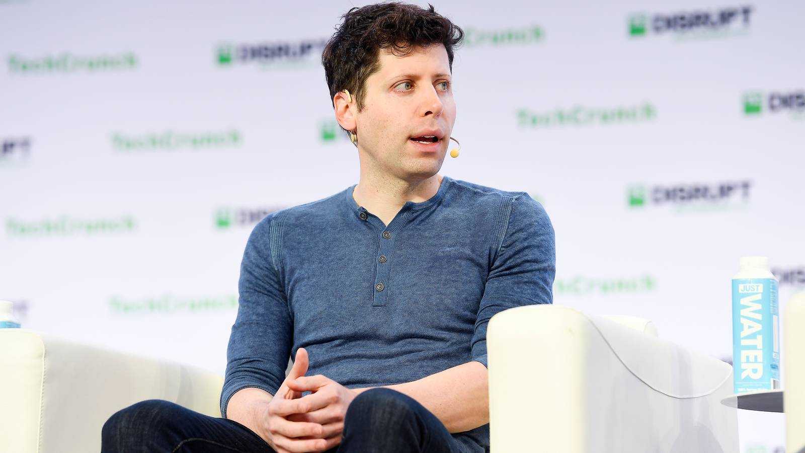Sam Altman sitting at a TechCrunch event