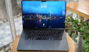 M3 Max MacBook Pro on a table showing the lock screen