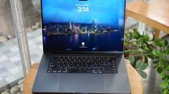 M3 Max MacBook Pro on a table showing the lock screen