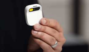 A person holding the Humane AI Pin.