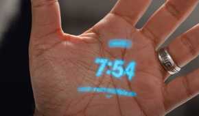The Humane AI Pin's laser display on a hand.