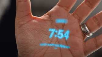 The Humane AI Pin's laser display on a hand.