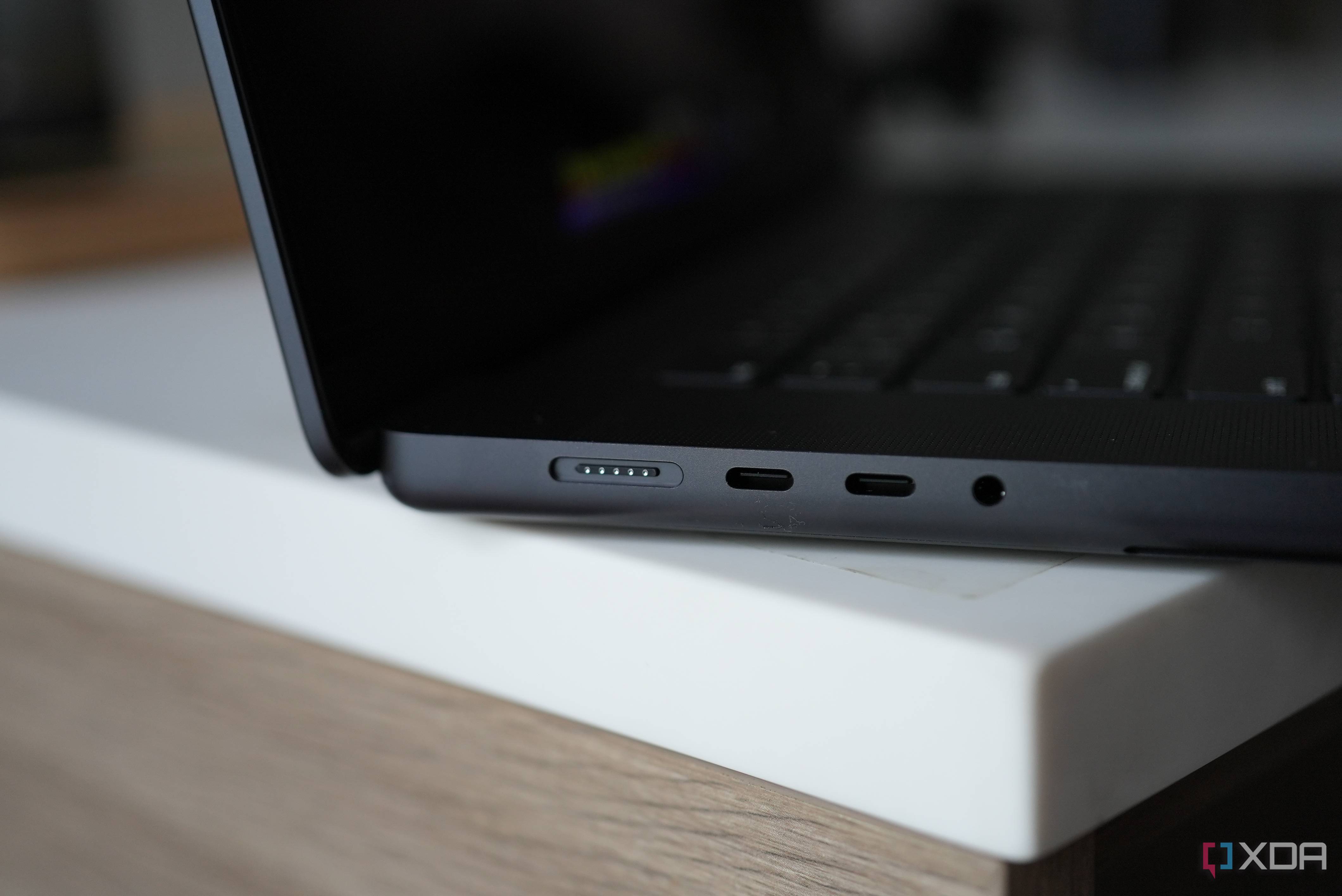 The left side of the MacBook Pro with MagSafe, two USB-C, headphone jack.