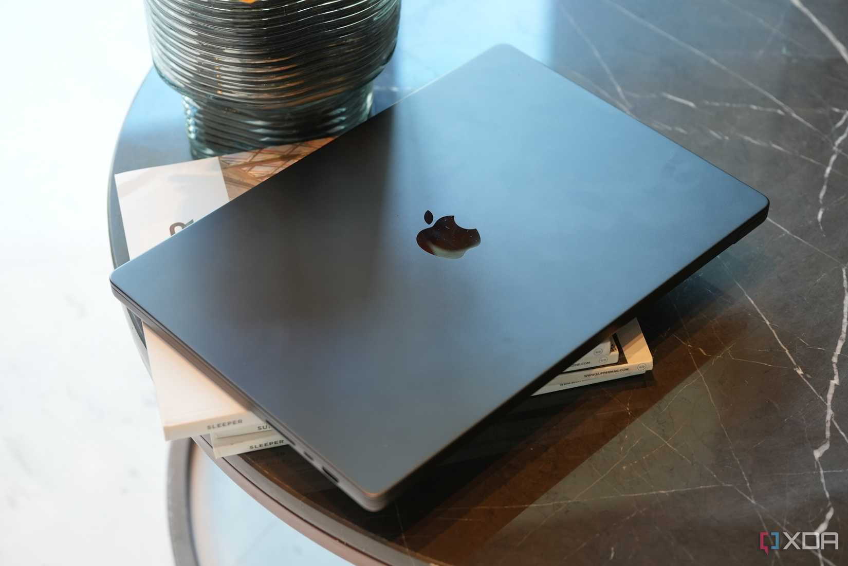 M3 Max Macbook pro in space black placed on a table