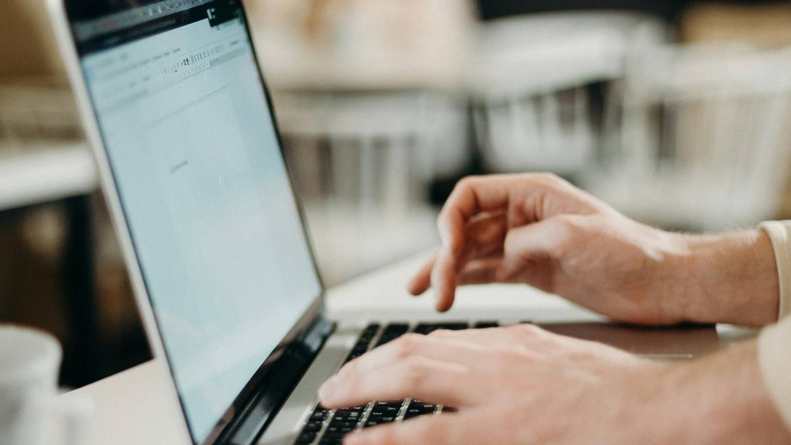 A person typing on a computer