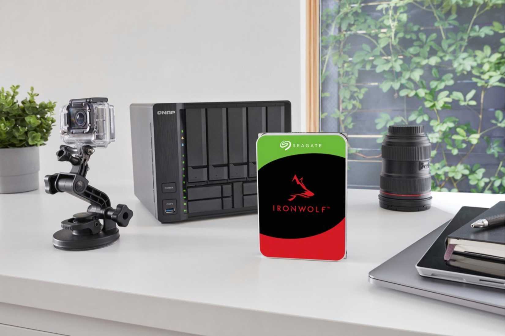 A Seagate 16TB hard drive beside a NAS.