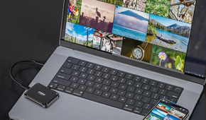Crucial X9 Portable SSD connected to a MacBook with an iPhone on the side