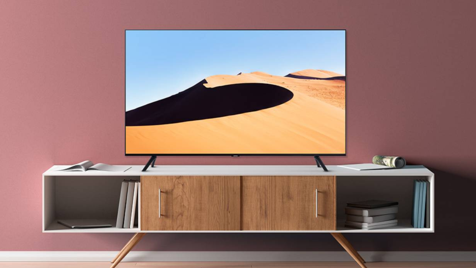 Samsung 85-inch Class CU7000 Crystal UHD 4K Smart Tizen TV in living room hanging on wall 