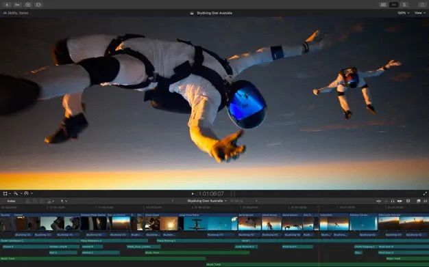 Final cut pro showing different audio tracks under a video of people sky diving
