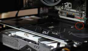 GPU installed in a PC case with the PCIe mounting bracket highlighted