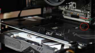 GPU installed in a PC case with the PCIe mounting bracket highlighted