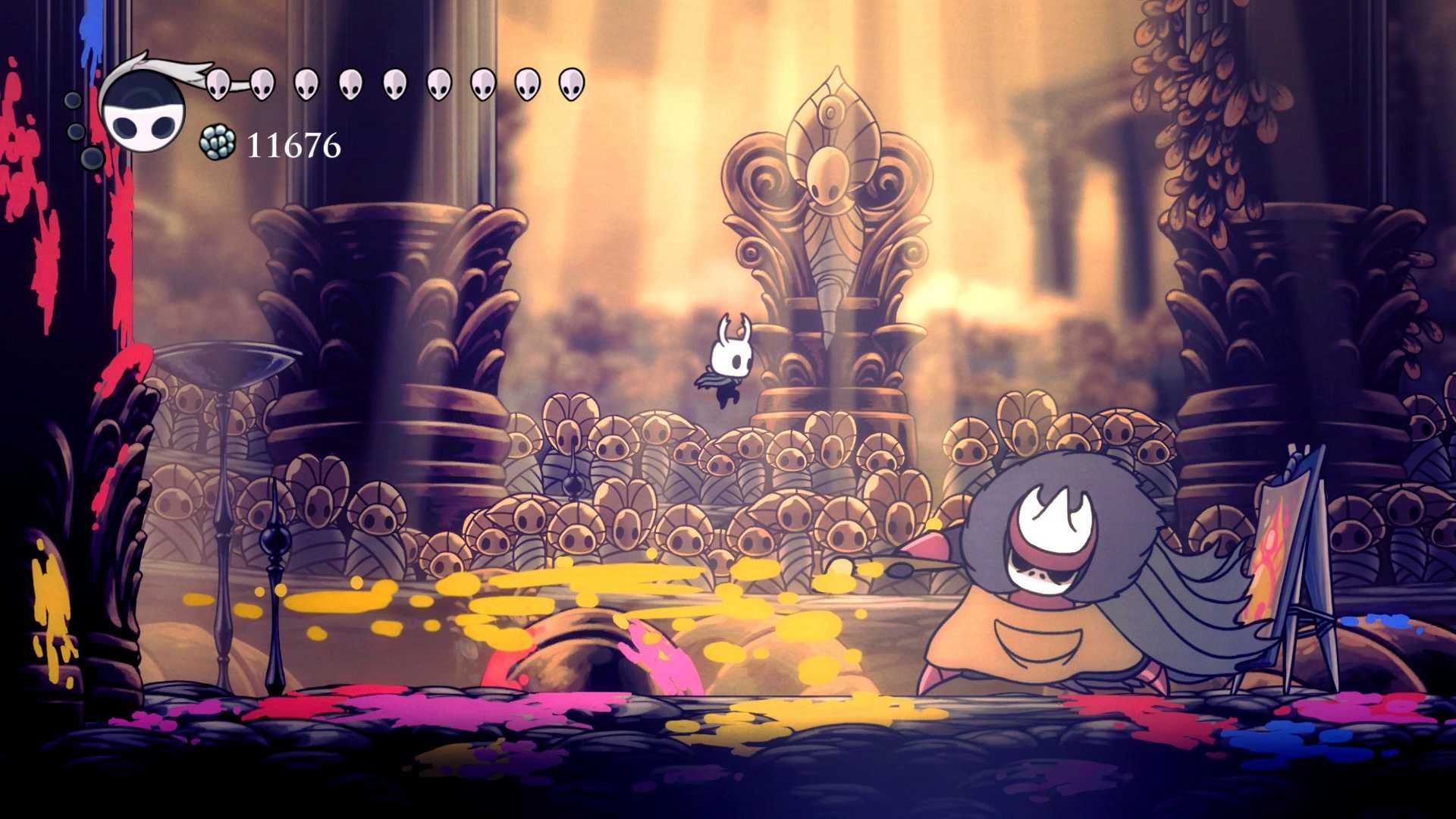 A tiny character jumping around a large creature from the game Hollow Knight.