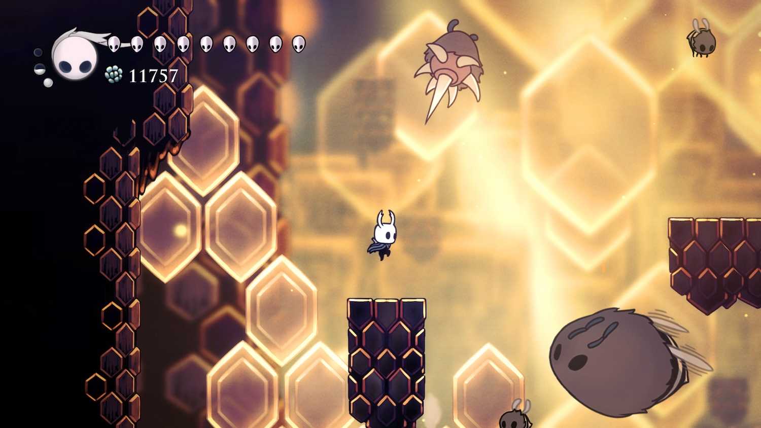 A bright scene with a character jumping on a platform from the game Hollow Knight.