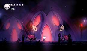 A character standing between two creatures from the game Hollow Knight.