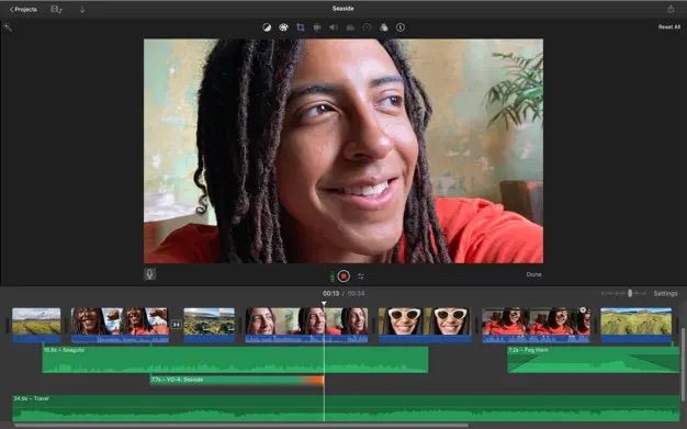 iMovie on Mac showing audio tracks being synced to video footage 