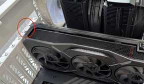 AMD Radeon GPU installed in case with mounting screws highlighted