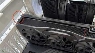 AMD Radeon GPU installed in case with mounting screws highlighted