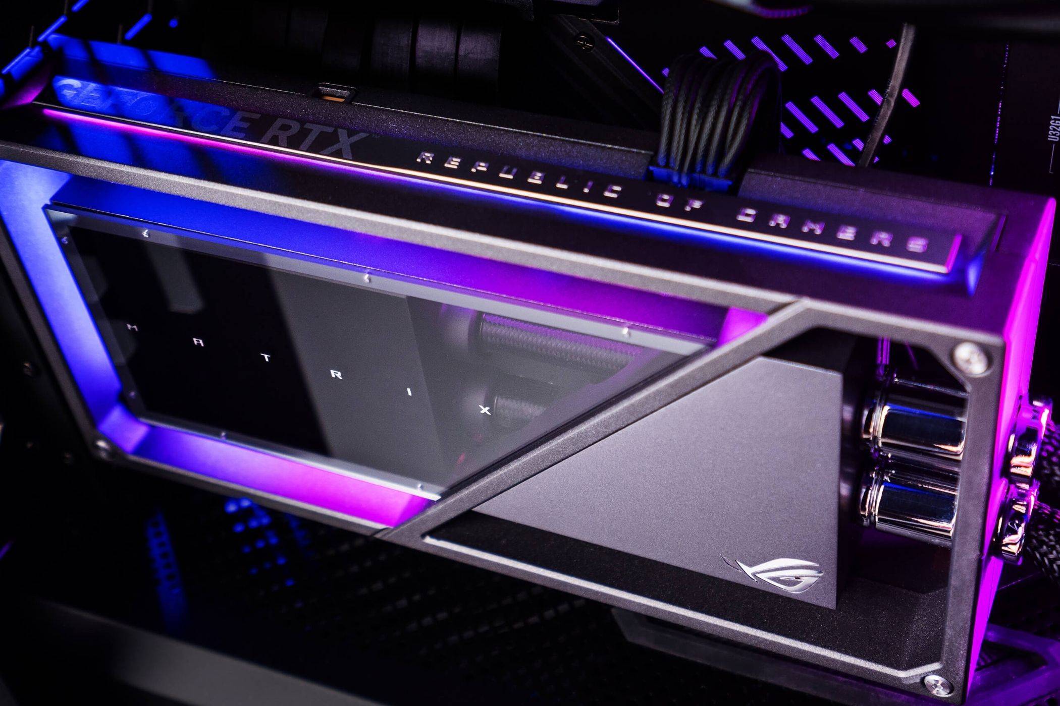 An image showing an ROG Matrix Platinum GeForce RTX 4090 graphics installed on a PC with RGB lights.