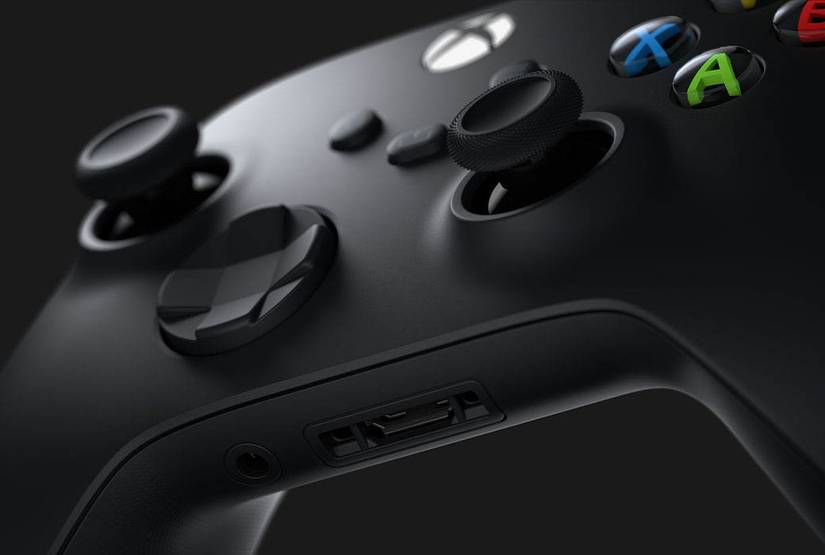 A close-up view of a black Xbox controller on an angle.