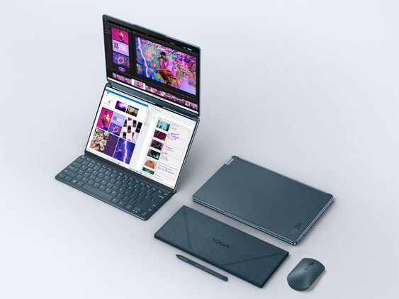 A photo of the Yoga Book 9i with all the accessories and the screen open in the vertical mode